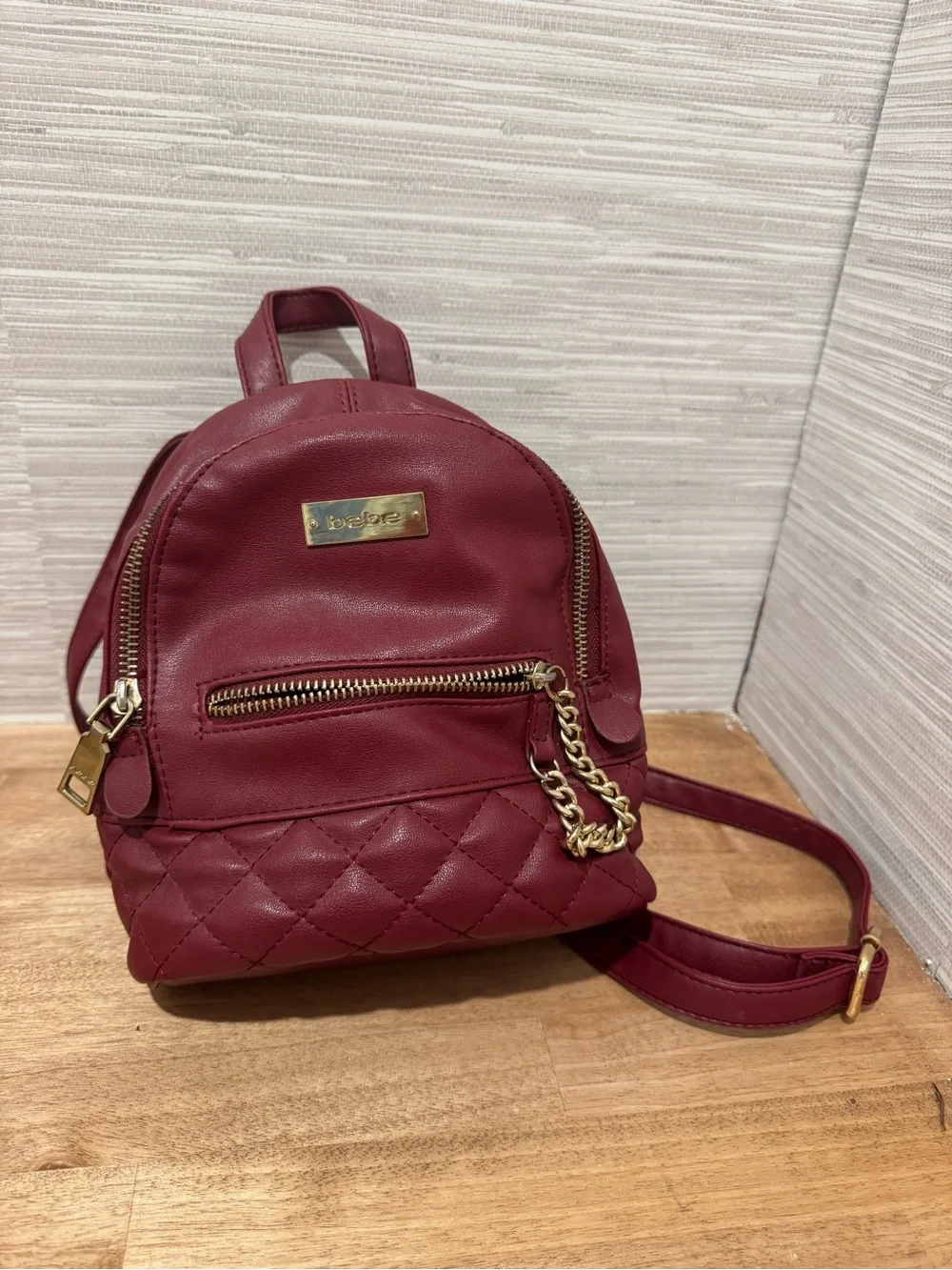 bebe Small Quilted Backpack in Burgundy with Gold Chain